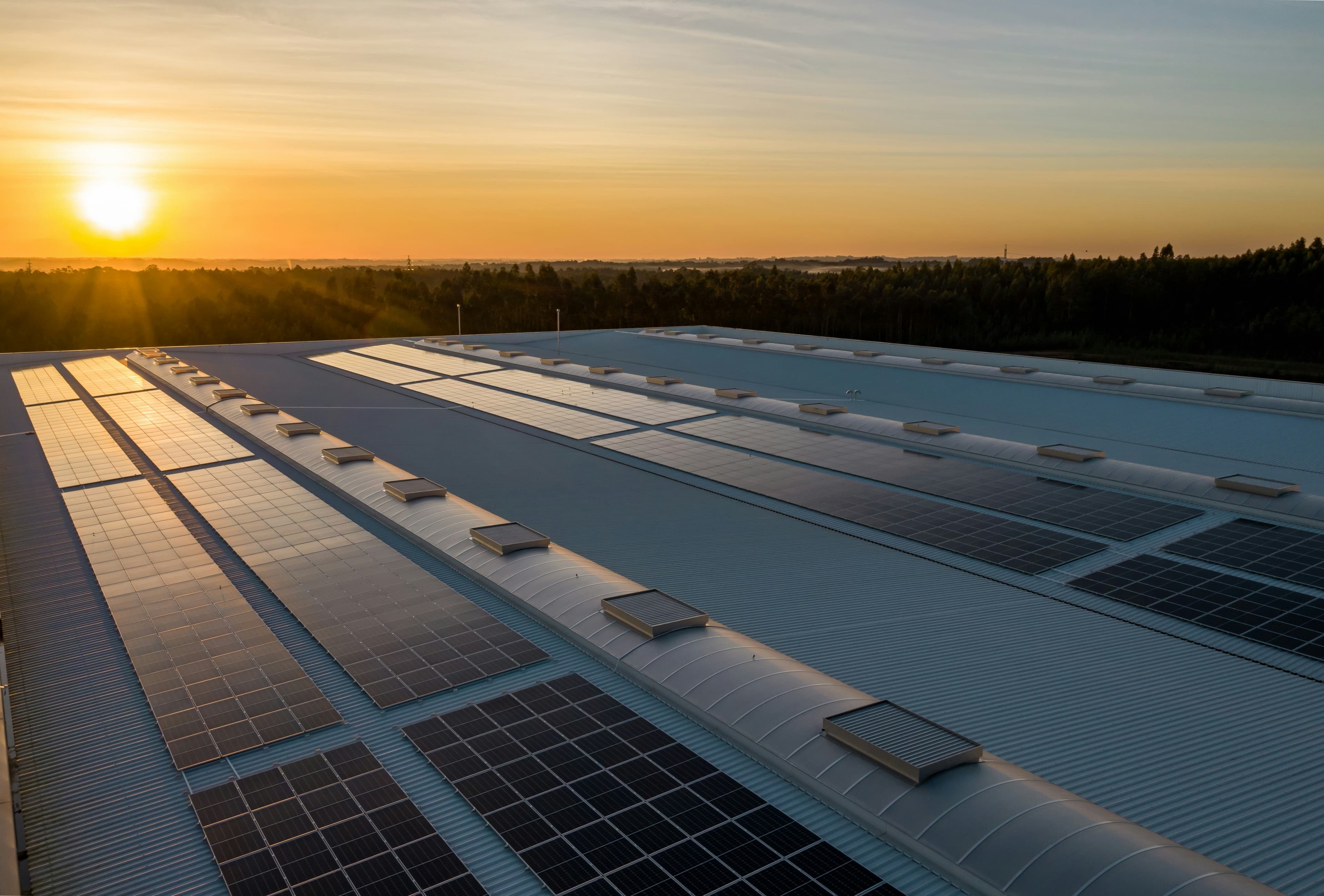 Rooftop solar panels on a commercial building, the kind of sustainable upgrade ARCS helps finance